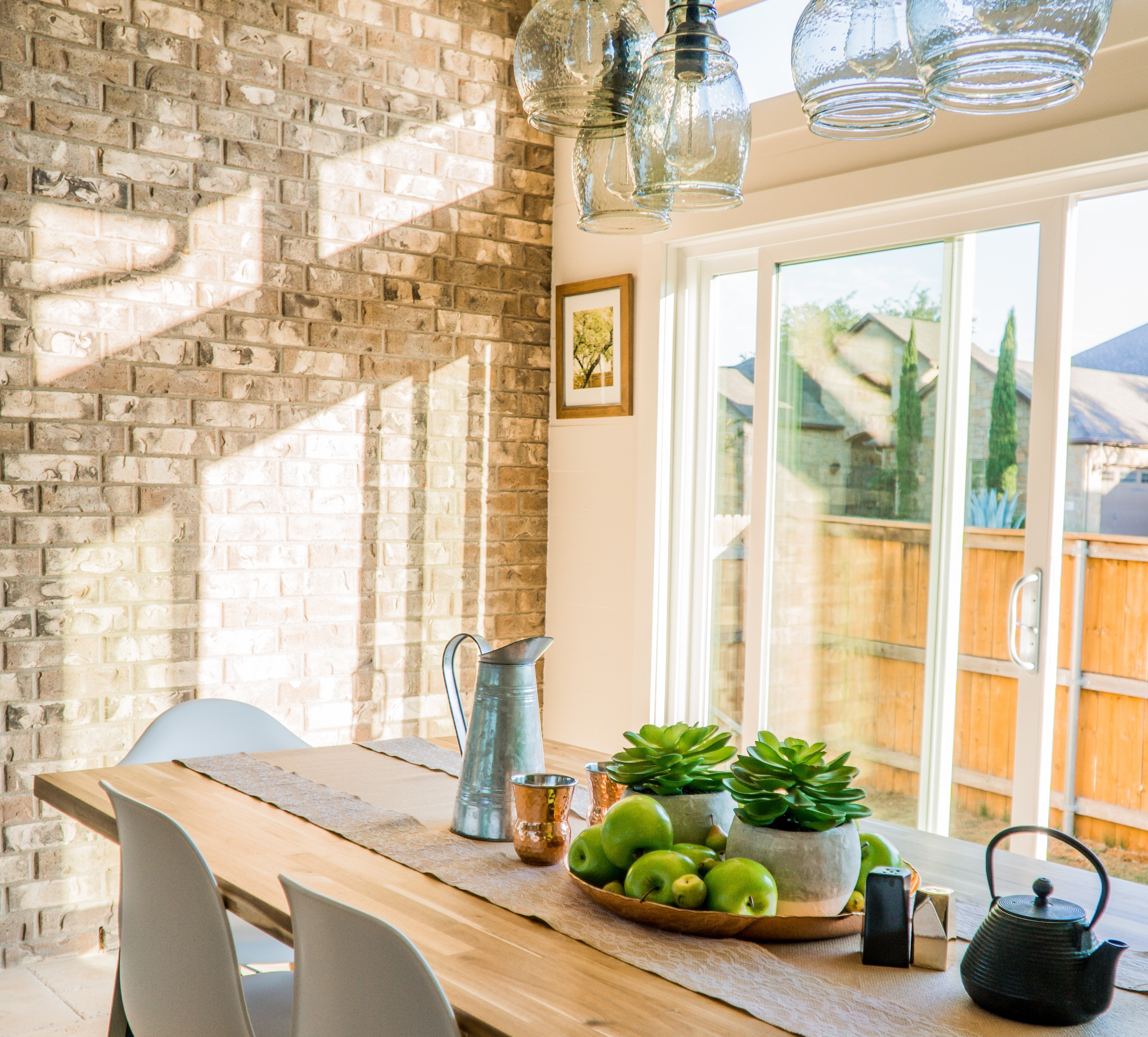 black-kettle-beside-condiment-shakers-and-green-fruits-and-1080696